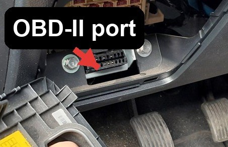 OBD-II port location on a Hyundai i10 (IA, 2014-2019), low on the driver's side below the fuse box above the pedals