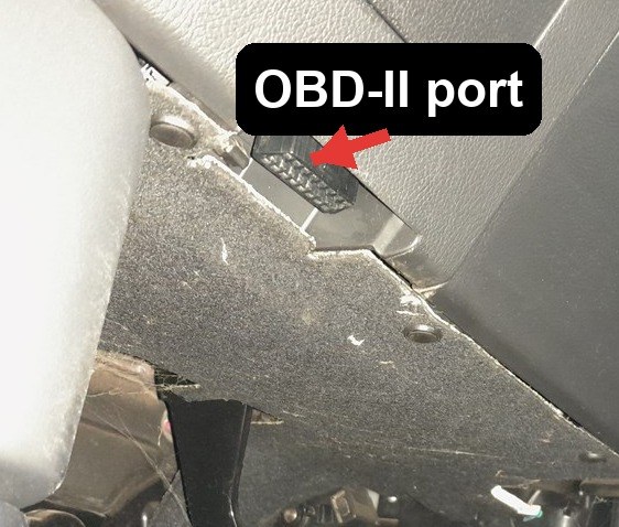OBD-II port location on a Mitsubishi Outlander (GF, 2012-2021), under the dash on the driver's side above the pedals